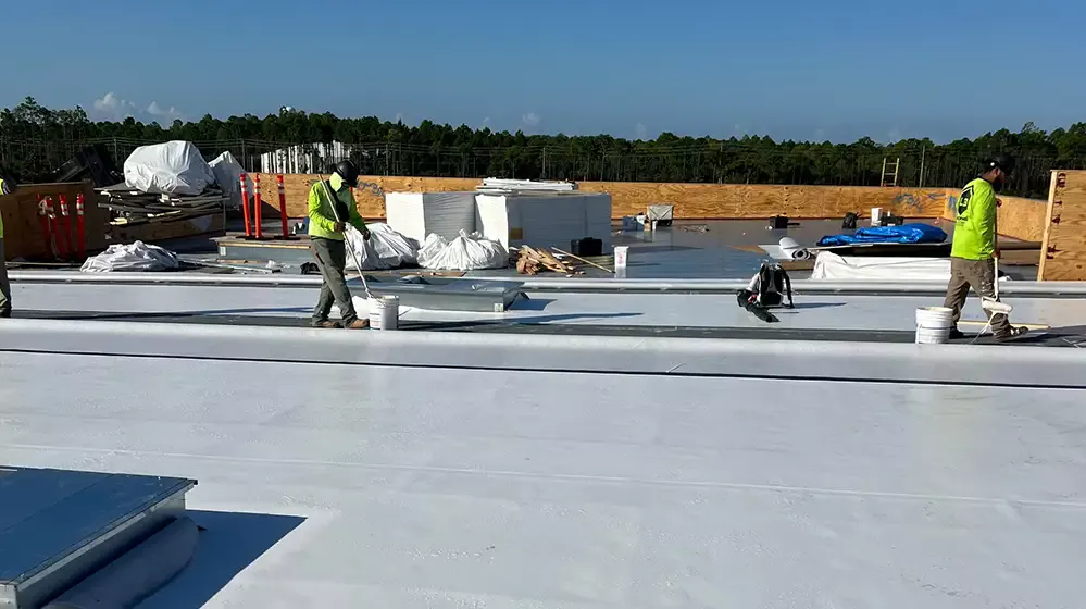 Workers installing new commercial roof